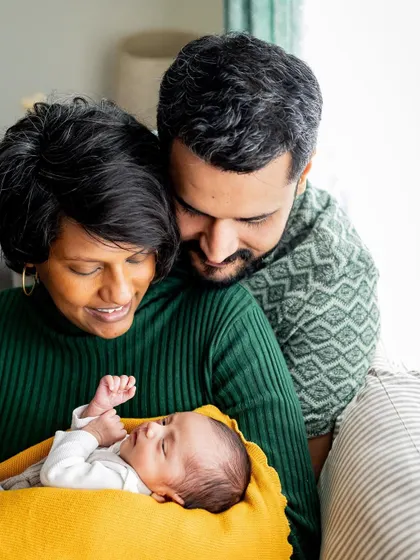 There's so much love in this cozy family portrait on the couch. At-home lifestyle sessions are all about capturing your family's authentic connections in your own comfortable space.