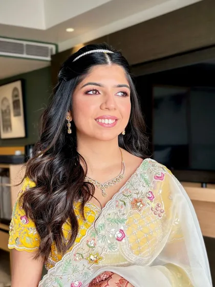 A portrait of the bride for her Mehendi morning. We went for a subtle color pop on the eyes and glowing, pink-pinched cheeks.