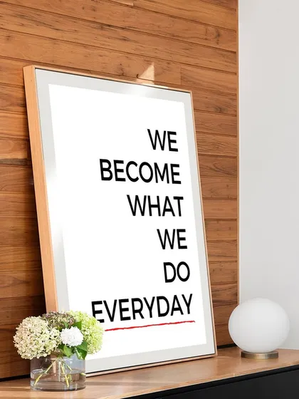 Our motivational quote print shown on a modern console table. The natural wood frame and simple typography create a clean, inspiring accent for any room.