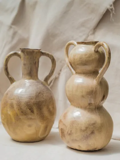 These two wheel-thrown vases, with their beautiful, earthy glaze and classic forms, were made by students in our Foundation course. They reflect a journey of experimenting, shaping, and expressing through form and texture.