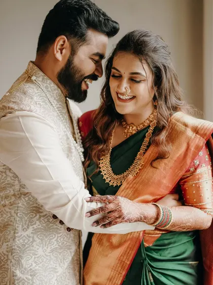 A moment of shared laughter during their engagement shoot. These genuine smiles are what make a photo truly special.