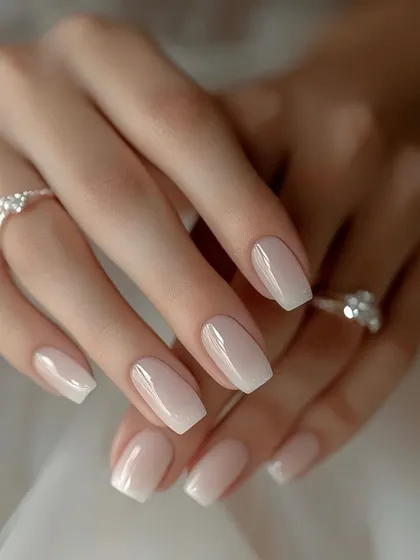 A classic and timeless choice for any special occasion. These are perfectly shaped, short square nails with a subtle and clean baby boomer effect.