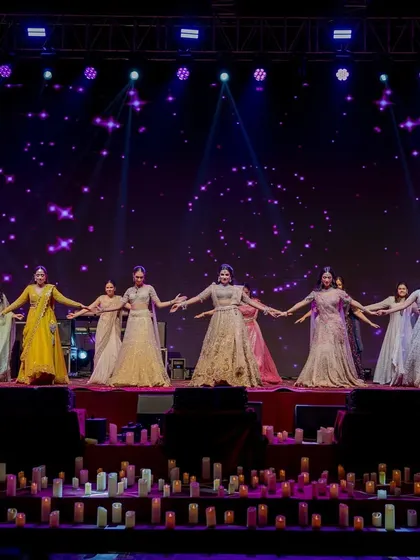 The bride and her bridesmaids performing on the candle-lit stage. The coordinated outfits and simple, graceful choreography looked beautiful against the starry night backdrop of our Sufi theme.