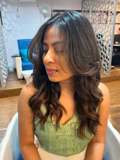 Curtain bangs and invisible layers for Tanuja.