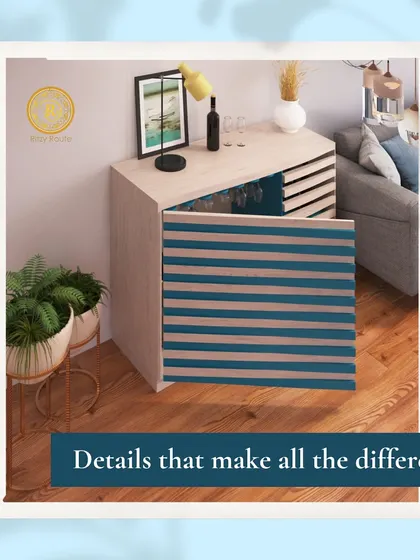 Details that make all the difference. This compact and modern bar cabinet features a unique slatted door design, offering a clever and stylish storage solution for a smaller living space.