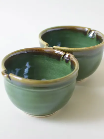 A clear shot of the green ceramic bowls, showing the detail of the rim and the earthy brown edge. These are part of my studio ceramic range, where every piece is made with love and attention to detail.