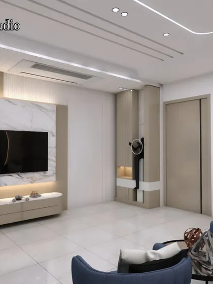 Here is a living room layout featuring a marble-clad TV unit with integrated backlighting. The design focuses on clean lines and a sophisticated color scheme with blue accent chairs for a pop of color.