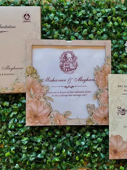 This invitation features a beautiful frame of pastel-colored flowers. The design is soft and romantic, perfect for a daytime wedding.