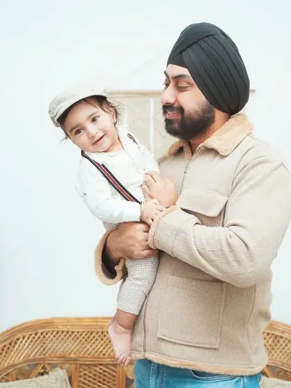 A candid moment between a father and his son. We aim to capture the natural, loving interactions that happen during our family photoshoots.