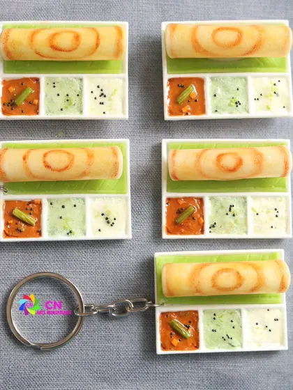 A set of dosa platter miniatures, perfect for magnets or keychains. The course teaches you how to create the platter, dosa, and all the side dishes.