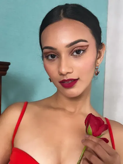 A romantic and dramatic look featuring a graphic red liner and a bold red lip. This is a powerful, monochromatic look that's perfect for a Valentine's themed or high-fashion shoot.