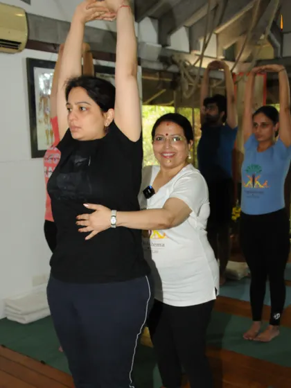 Selflessness starts with self care. Here I am adjusting a student in Tadasana, helping her reconnect with her inner strength so she can nurture others with confidence.