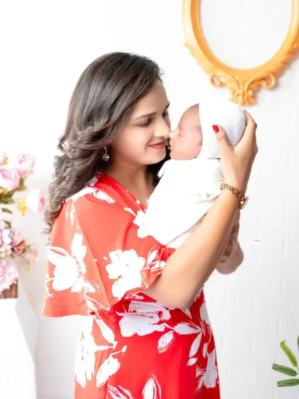 A mother's love captured in a tender moment with her newborn. These intimate portraits are filled with emotion and are truly timeless.