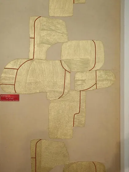 An abstract wall panel from our design event showcase. The design features geometric shapes made from textured, handwoven material, outlined in a contrasting color for a modern, artistic look.