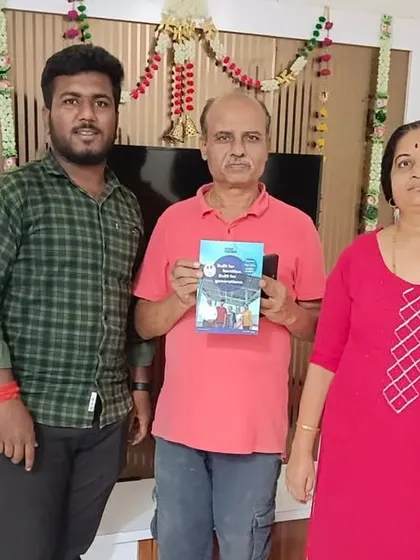 A family proudly holds their new solar agreement.