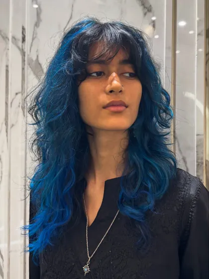 This layered blue look is edgy, modern, and full of personality.