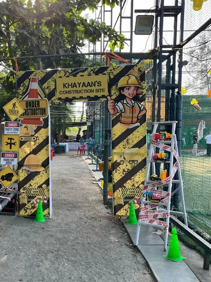 Welcome to Khayaan's Construction Site. The entrance arch was designed with caution tape, warning signs, and a friendly construction worker character to welcome the crew.