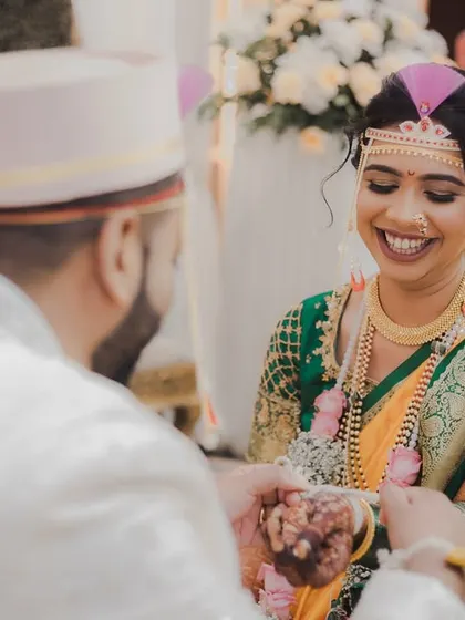 A beautiful, smiling bride during her Marathi wedding ceremony. We capture the grace and happiness of brides as they participate in their cultural traditions.