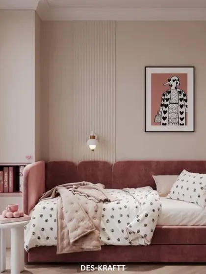 A soft and stylish room featuring a dusty rose daybed, polka dot bedding, and a fluted wall texture that adds a layer of modern sophistication.