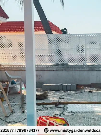 During the installation of a terrace makeover, a PVC lattice screen is added for privacy. This material is durable, weather-resistant, and adds a clean, modern aesthetic.