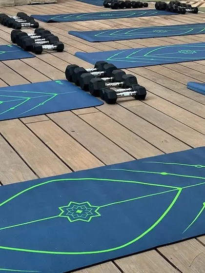 The calm before the storm. Setting up for our outdoor training event, with mats and dumbbells ready for a morning of movement and community energy.