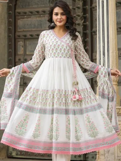 A classic white Anarkali with delicate pink and grey block-print style motifs. The angrakha-style neckline adds a traditional touch to this graceful and breezy outfit.