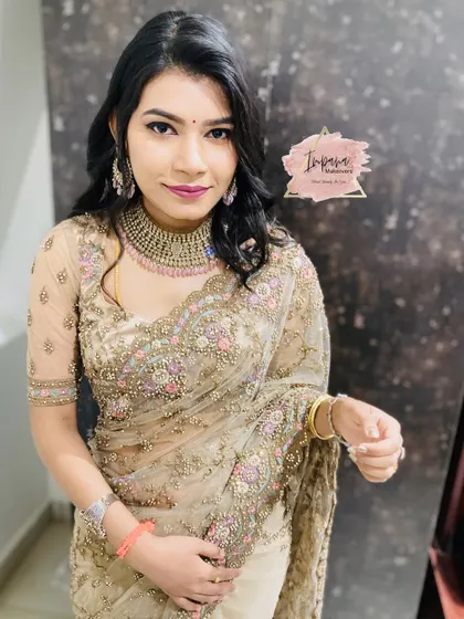 The bride looking directly at the camera, showcasing her flawless HD makeup. This look is perfect for an evening of celebration, ensuring she looks her best in all photos.