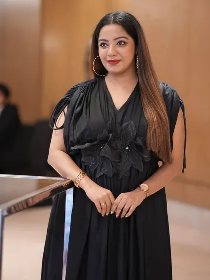 A candid photo from the Fracto Prop product launch. The black and gold theme of my outfit was chosen to align with the event's classic and sophisticated branding.