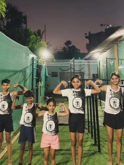 Our CaliKids showing off their strength. They wear the Califit logo with pride, knowing they are part of a strong family.