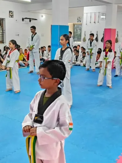 A class of yellow and green belts.