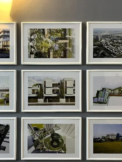A gallery wall in our studio, showcasing the breadth and diversity of our projects. Each framed image is a story of a design challenge met and a vision realized.