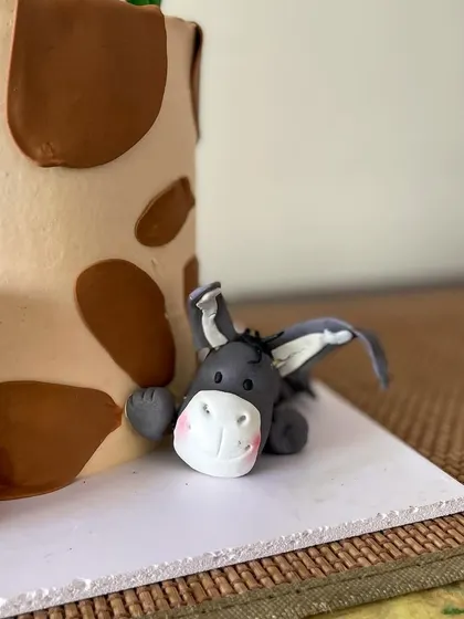 A detailed shot of the adorable sleepy donkey fondant figure.