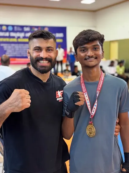 Celebrating a win with one of our promising young fighters. This is the start of a long journey.