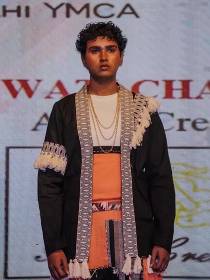 A student model presents a contemporary take on tribal wear, blending modern and traditional elements.