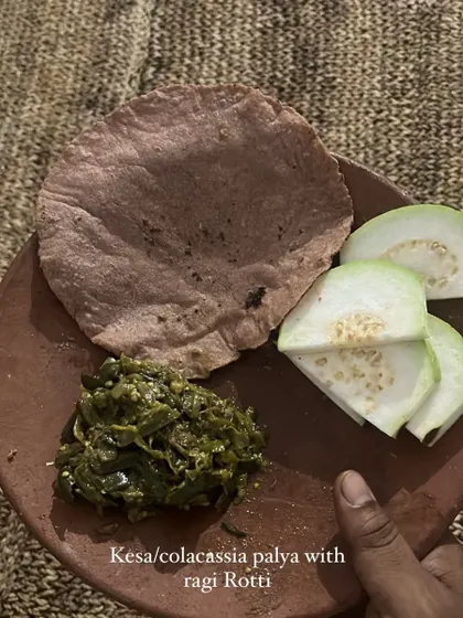 A simple yet powerful meal of Kesa (colocassia) palya with ragi rotti and fresh guava, highlighting the use of local greens and millets.