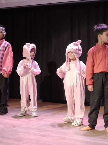 Our youngest actors, dressed as pigs, showing great stage discipline and character embodiment. Even in non-speaking roles, presence and physicality are key.