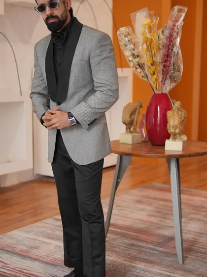 A full view of our grey patterned tuxedo, demonstrating its versatility for a formal night out. The design is both sophisticated and unique, perfect for the man who wants to stand out with refined style.