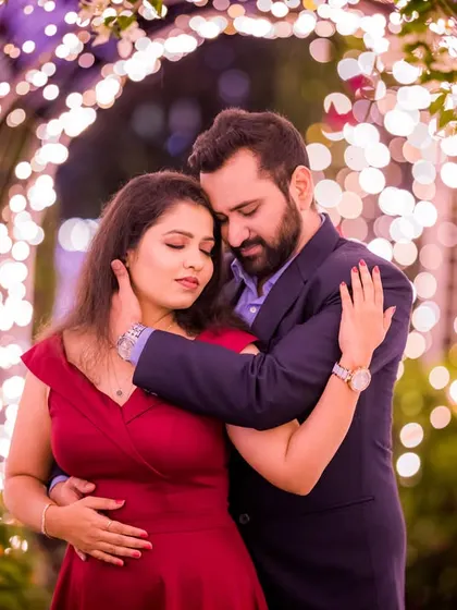 A deeply romantic and cinematic shot of a couple in a light tunnel. The warm lighting and their close embrace create a powerful, emotional pre-wedding photograph.