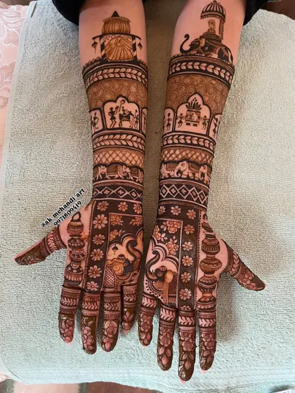 This Rajasthani-style bridal mehndi tells a complete story, with motifs of elephants, palanquins (doli), and traditional architecture.