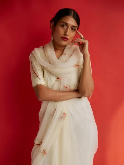 Another elegant portrait of the actress Richa. The thoughtful pose and the beautiful drape of the saree create a sophisticated and intelligent mood.