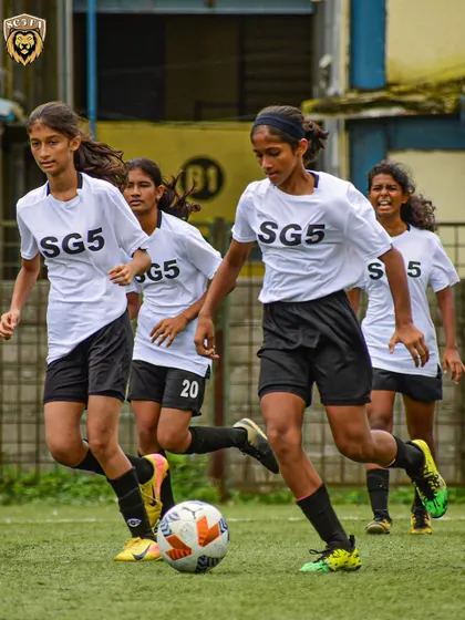 Our Lionesses working together to advance the ball up the field, demonstrating the teamwork we emphasize in training.