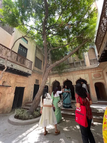 The restored courtyard of the Kathika haveli in Old Delhi, now a thriving cultural center. The project proves that restoration is not just about walls and plaster; it's about bringing people and life back into a historic space.