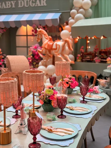 A miniature Eiffel Tower prop adds a perfect Parisian touch to the table, tying the whole theme together beautifully.