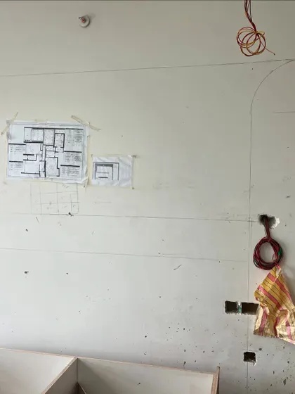 From a floor plan on paper to markings on the wall. This is a critical step where we translate the 2D drawings into the physical space, ensuring every measurement and placement is precise.