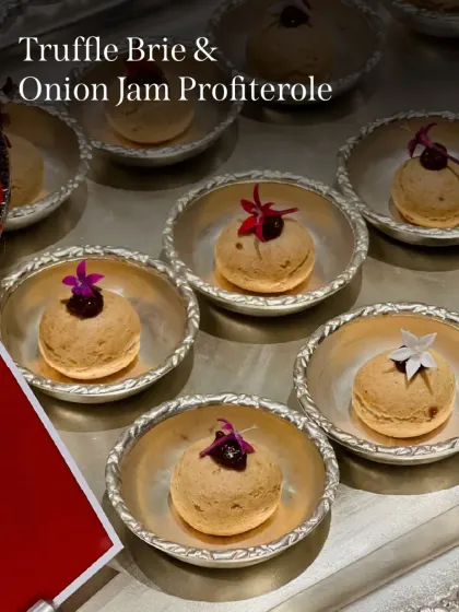 Truffle & Brie Profiteroles with Onion Jam. These savory cream puffs are filled with an earthy, cheesy mousse and topped with sweet jam.