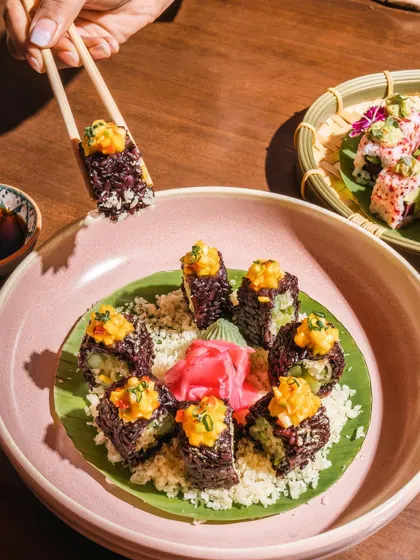 A closer look at our unique Purple Rice and Asparagus Sushi. The vibrant colors and fresh ingredients make this a healthy and delicious choice for any sushi lover.