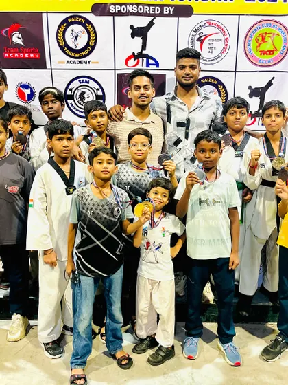 The team celebrating their wins at a local championship. Every medal won is a victory for the entire academy.
