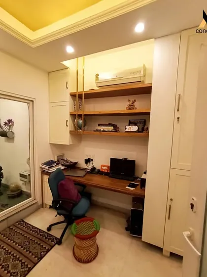 The completed study nook, fully functional and integrated into the room. The design includes a wooden desk, open shelving for easy access, and tall cabinets for ample storage, making it a perfect work-from-home solution.