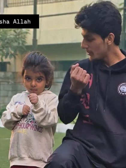A close-up shot of me teaching a fighting stance to one of my youngest students.