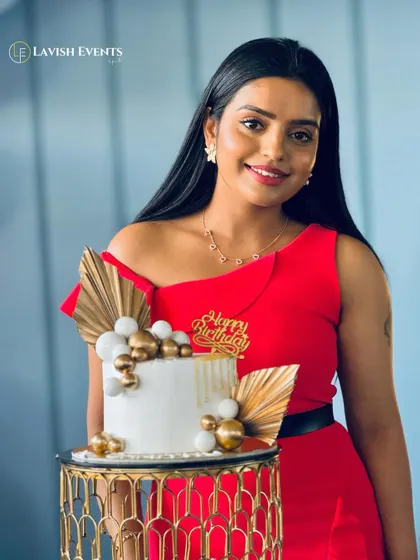 A beautiful portrait of the birthday girl and her stylish cake.